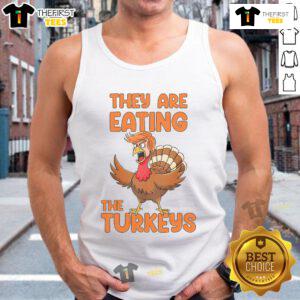 Funny Thanksgiving Trump turkey tank top design featuring cartoon turkeys humorously eating other turkeys.