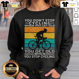 Alt Text: Vintage sweatshirt featuring the phrase You Don't Stop Cycling When You Get Old with a bike graphic.