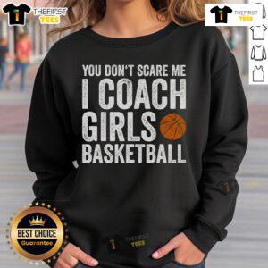 Nice You Don't Scare Me I Coach Girls Basketball Sweatshirt displayed on a hanger, showcasing its sporty design and message.