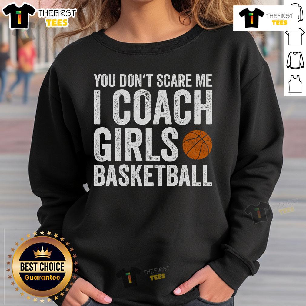 Nice You Don't Scare Me I Coach Girls Basketball Sweatshirt displayed on a hanger, showcasing its sporty design and message.