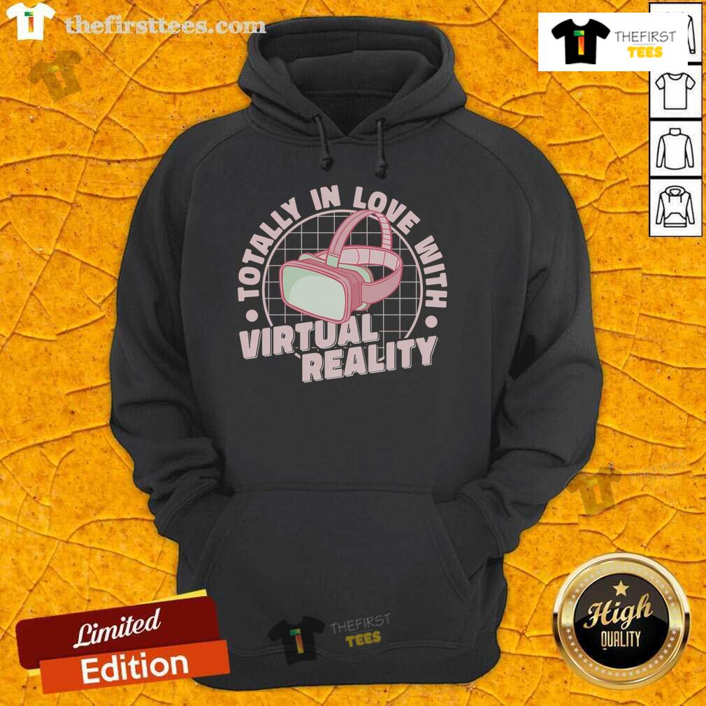 Enthusiastic gamer wearing a 'Pretty Totally In Love With Virtual Reality' hoodie, immersed in a VR gaming experience.