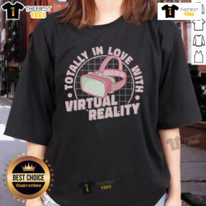 Pretty ladies in VR headsets enjoying virtual reality gaming, showcasing a love for video games in stylish tees.
