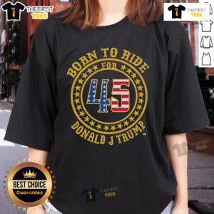 Stylish 'Born To Ride' Donald J. Trump ladies tee featuring a bold design, perfect for supporters and fashion enthusiasts.