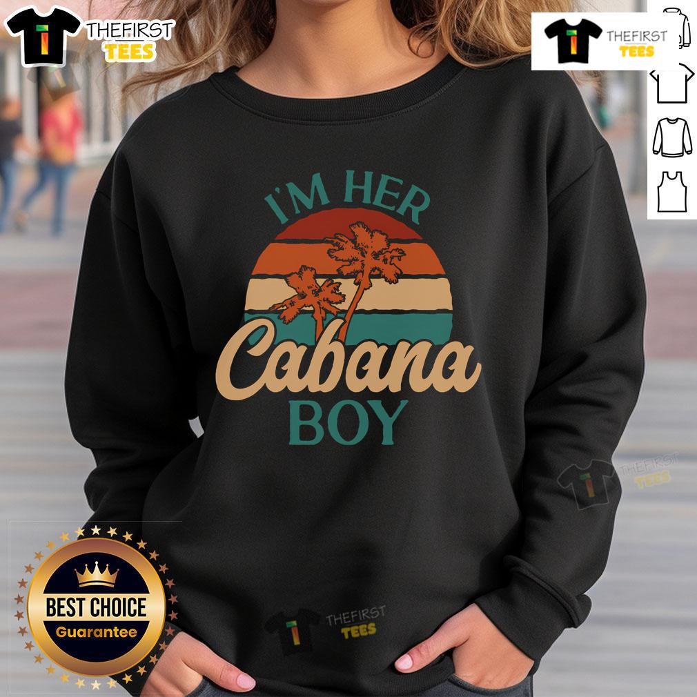 Casual 'I'm Her Cabana Boy' sweatshirt worn by a beach bartender at a vibrant seaside cabana.