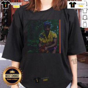 Alt Text: Childish Gambino Bando Stone and the New World album cover on a ladies tee, featuring vibrant colors and artistic design.