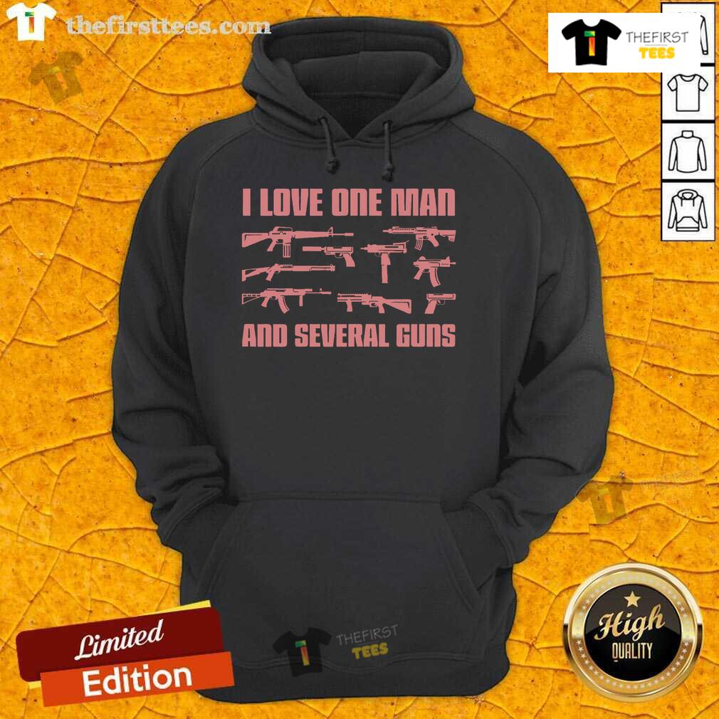 Woman wearing 'I Love One Man And Several Guns' hoodie, showcasing a stylish gun-themed design in a casual setting.