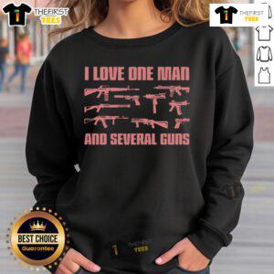 Stylish woman wearing 'I Love One Man And Several Guns' sweatshirt, showcasing a bold gun-themed fashion statement.