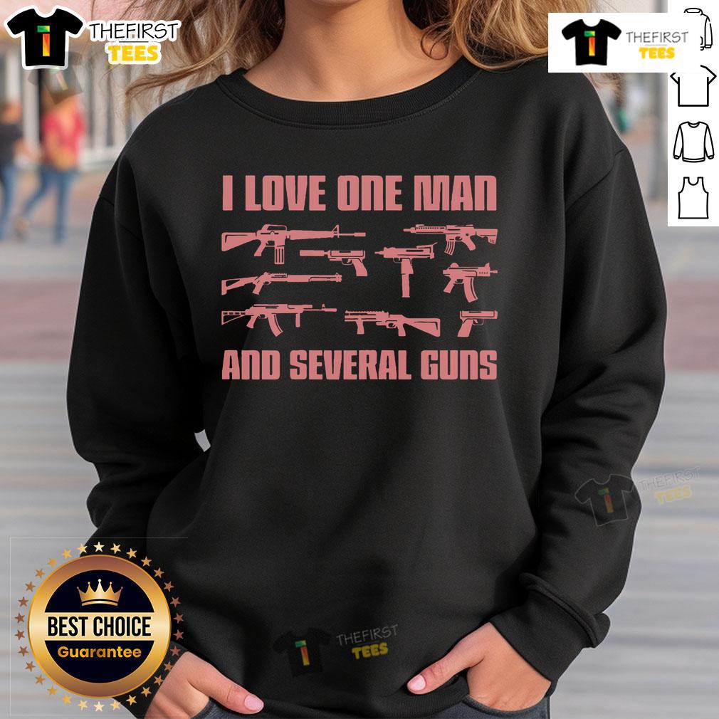 Stylish woman wearing 'I Love One Man And Several Guns' sweatshirt, showcasing a bold gun-themed fashion statement.