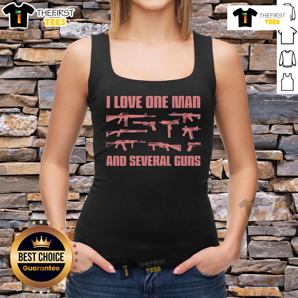 Woman wearing 'I Love One Man and Several Guns' tank top, showcasing her love for firearms and bold fashion.