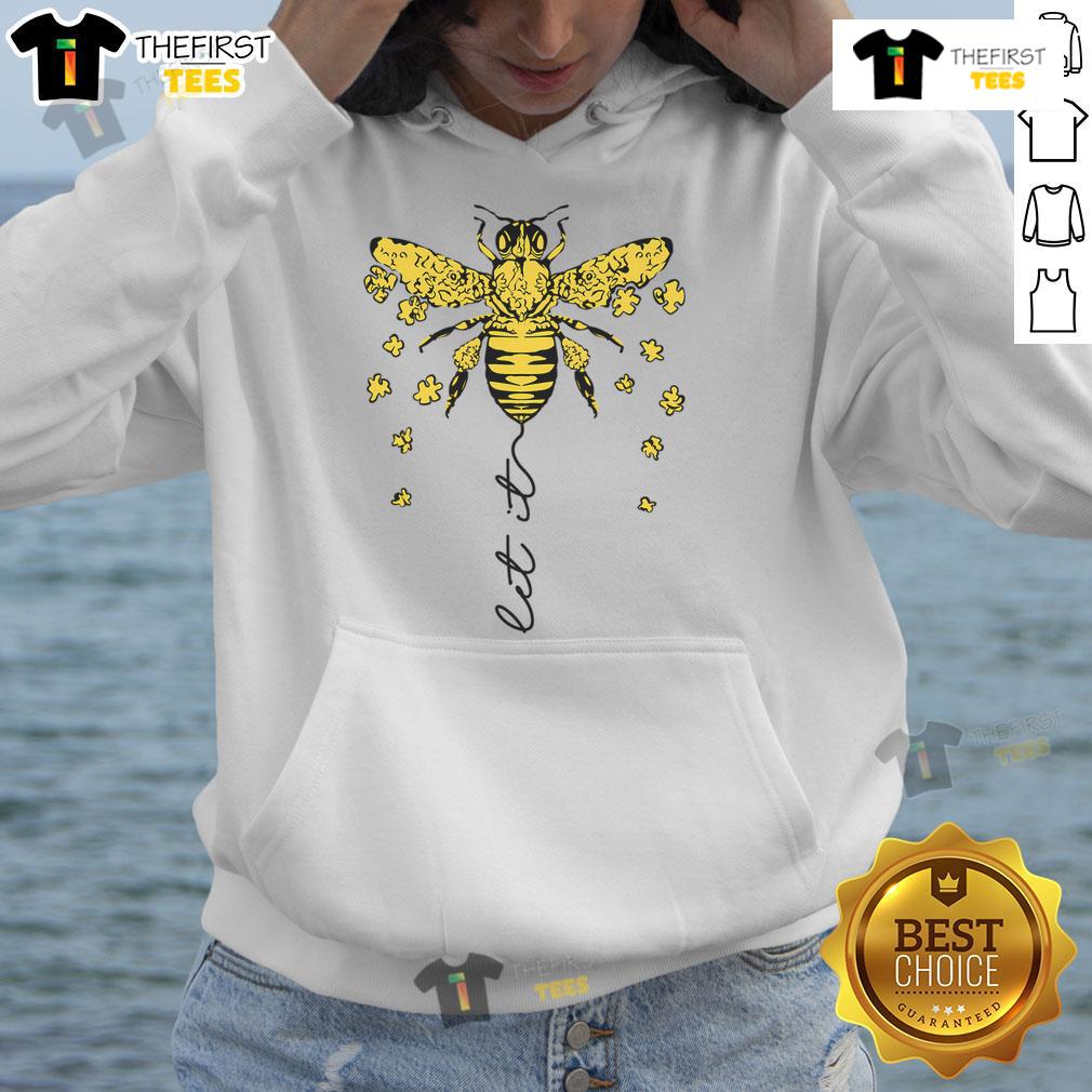 Nice Bee beekeeper in a bee hoodie holding honeycomb, promoting bee conservation and honey production.