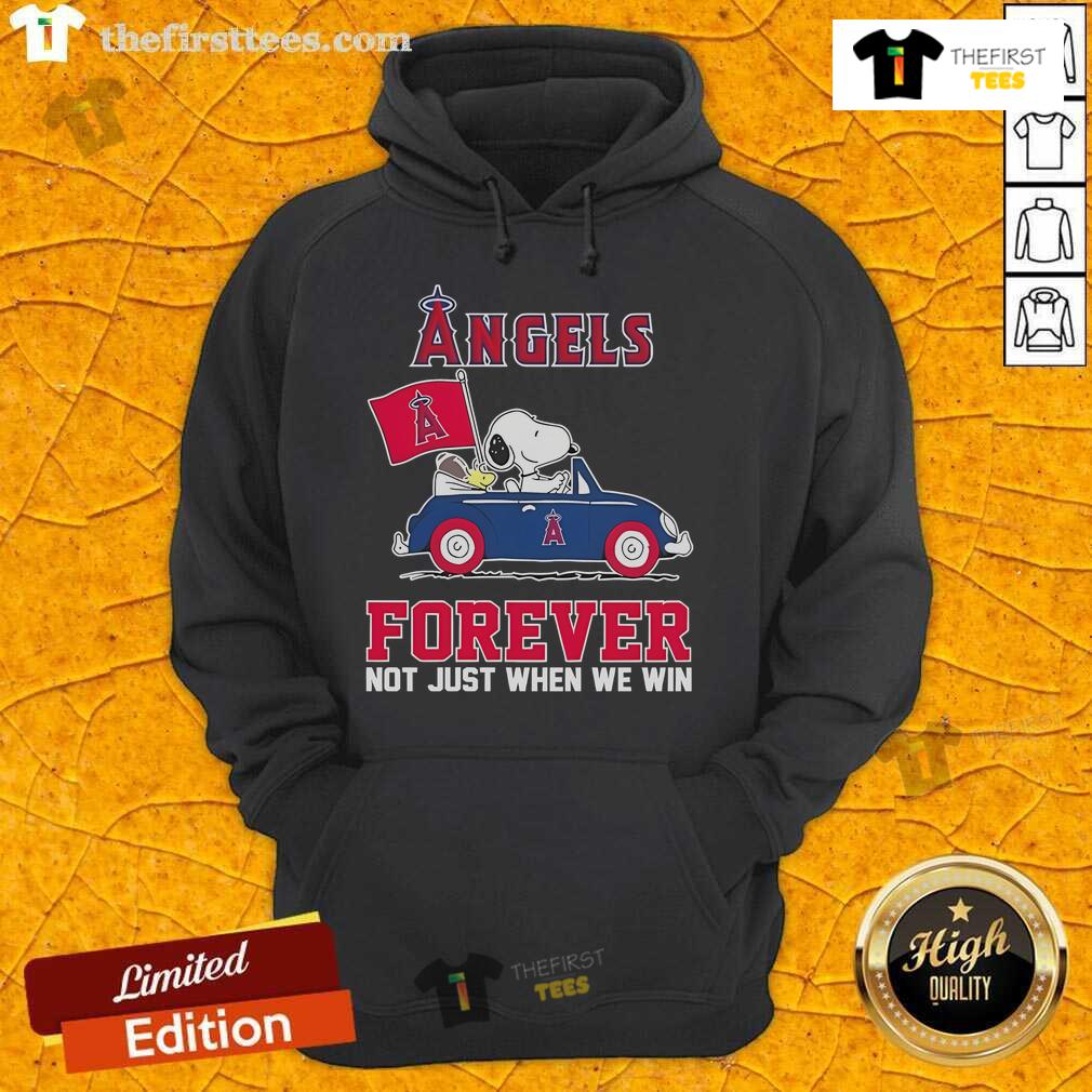 Snoopy and Woodstock joyfully drive a car on a Los Angeles street, showcasing the 'Angels Forever' hoodie for 2024.