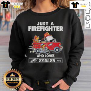 Alt Text: Snoopy and Woodstock driving a car, featuring a firefighter in an NFL Philadelphia Eagles sweatshirt.