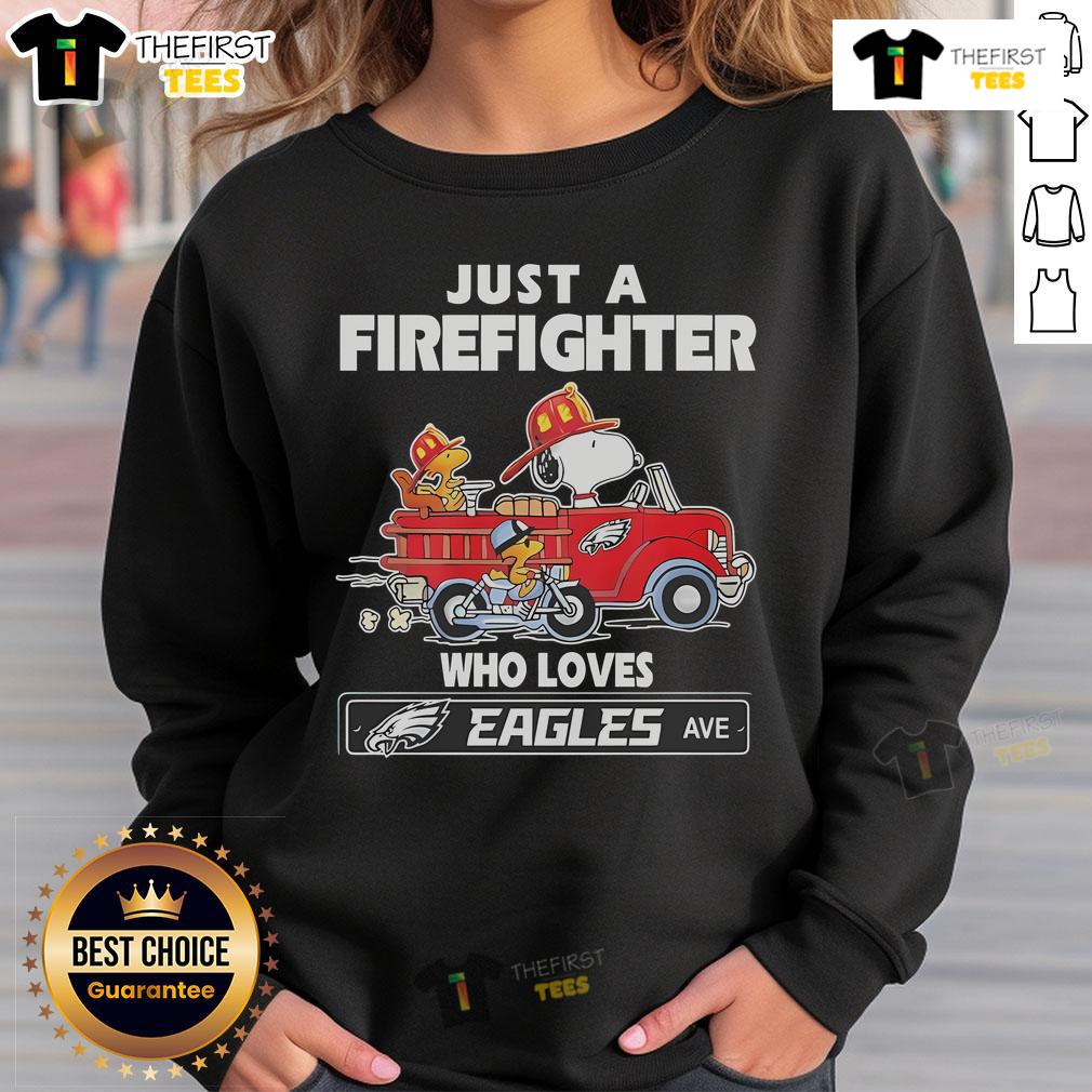 Alt Text: Snoopy and Woodstock driving a car, featuring a firefighter in an NFL Philadelphia Eagles sweatshirt.