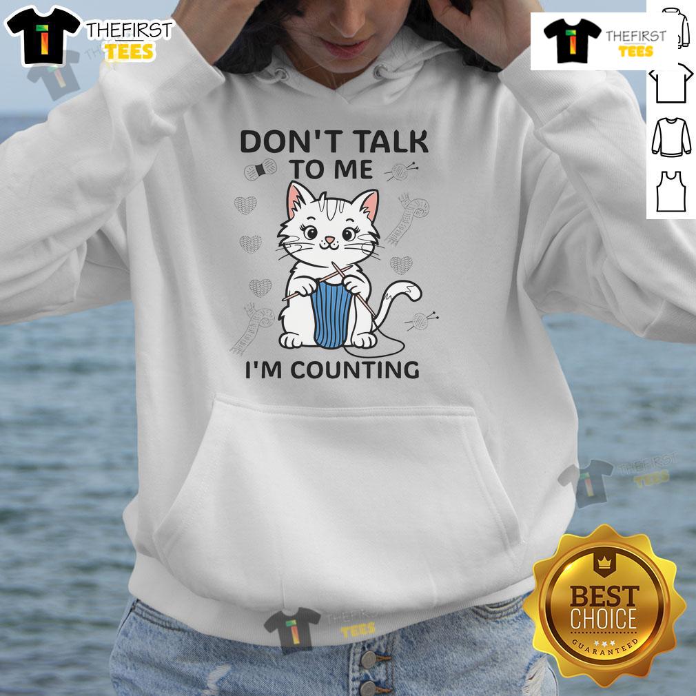 Cat wearing a hoodie with 'Don't Talk To Me, I'm Counting' graphic, perfect for knitting and crochet enthusiasts.