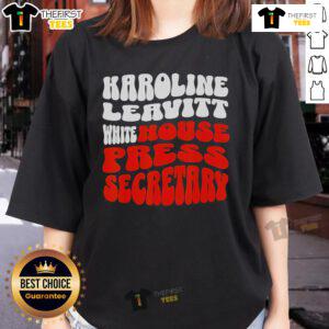 Official Karoline Leavitt white blouse tee for press secretaries, stylish design for professional womens attire.