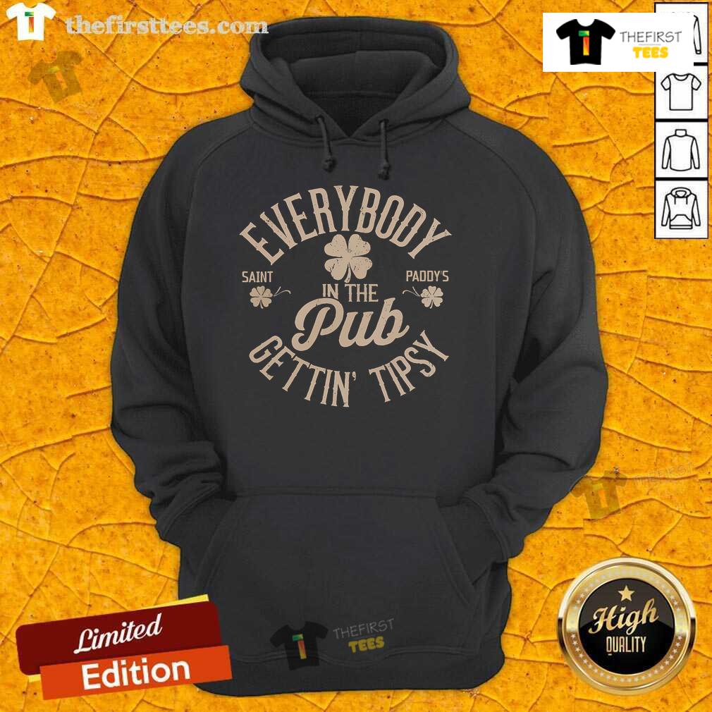 Premium Everybody In The Pub Getting Tipsy Hoodie worn by friends enjoying drinks and laughter in a cozy pub setting.