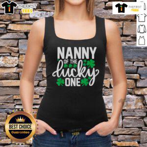 Adorable baby wearing a 'Top Nanny of the Lucky One' St. Patrick's Day tank top for their first birthday celebration.