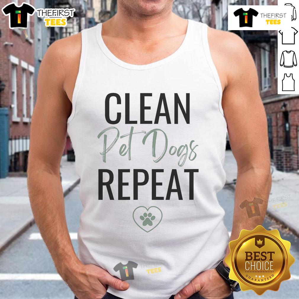Nice cleaning lady wearing a dog lover tank top, ready for her cleaning business, smiling and holding cleaning supplies.