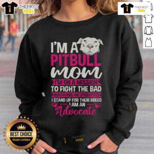 Pitbull mom wearing a sweatshirt advocating against stereotypes and bad reputations of Pitbulls.