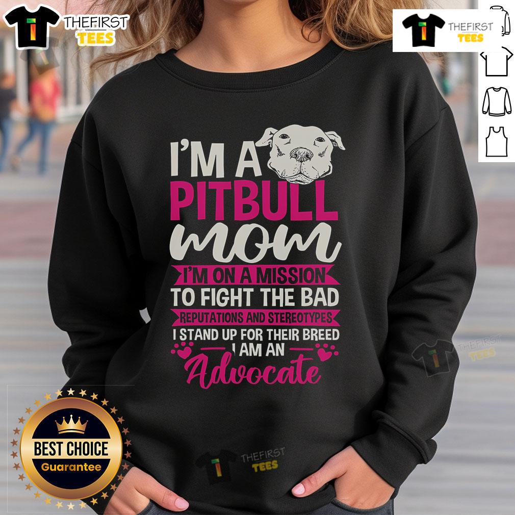 Pitbull mom wearing a sweatshirt advocating against stereotypes and bad reputations of Pitbulls.