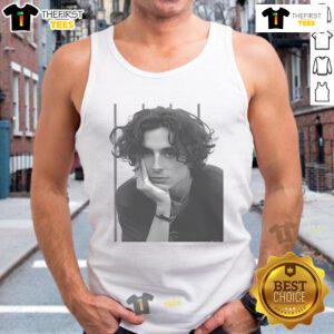 Hot Timothe Chalamet portrait wearing a stylish tank top, showcasing his signature look and captivating expression.