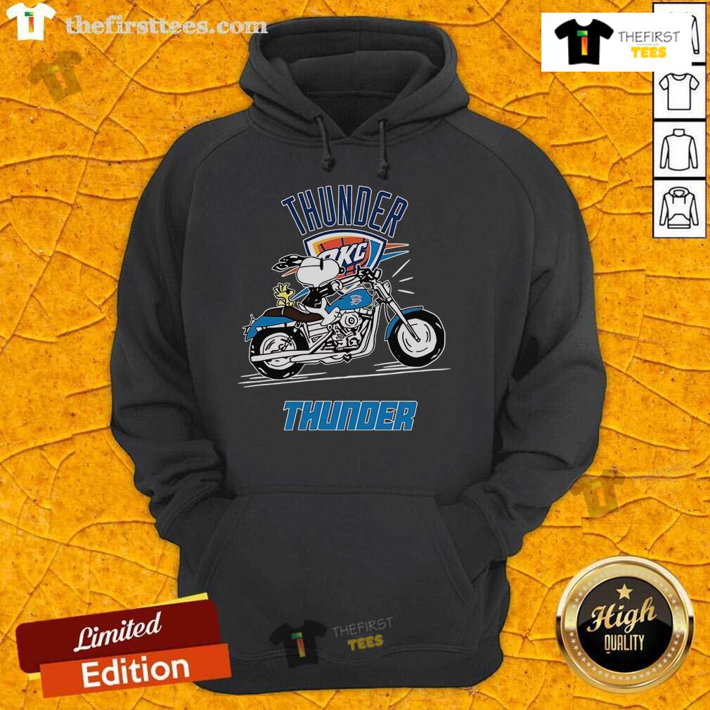 Alt Text: Snoopy and Woodstock riding a motorbike on an Oklahoma City Thunder hoodie, showcasing playful sports fashion.