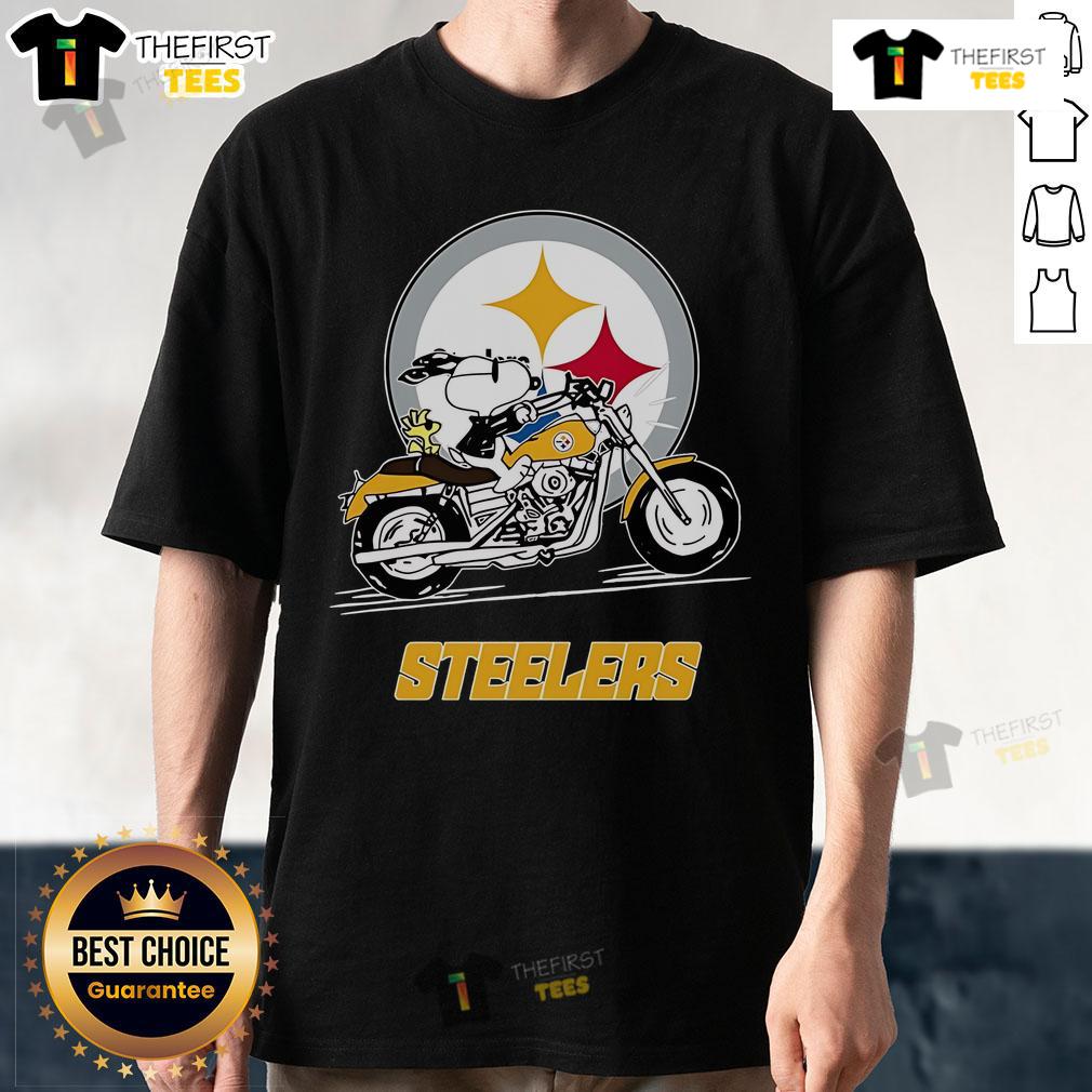 Official Snoopy and Woodstock driving a motorbike on a Pittsburgh Steelers T-shirt, perfect for NFL fans.