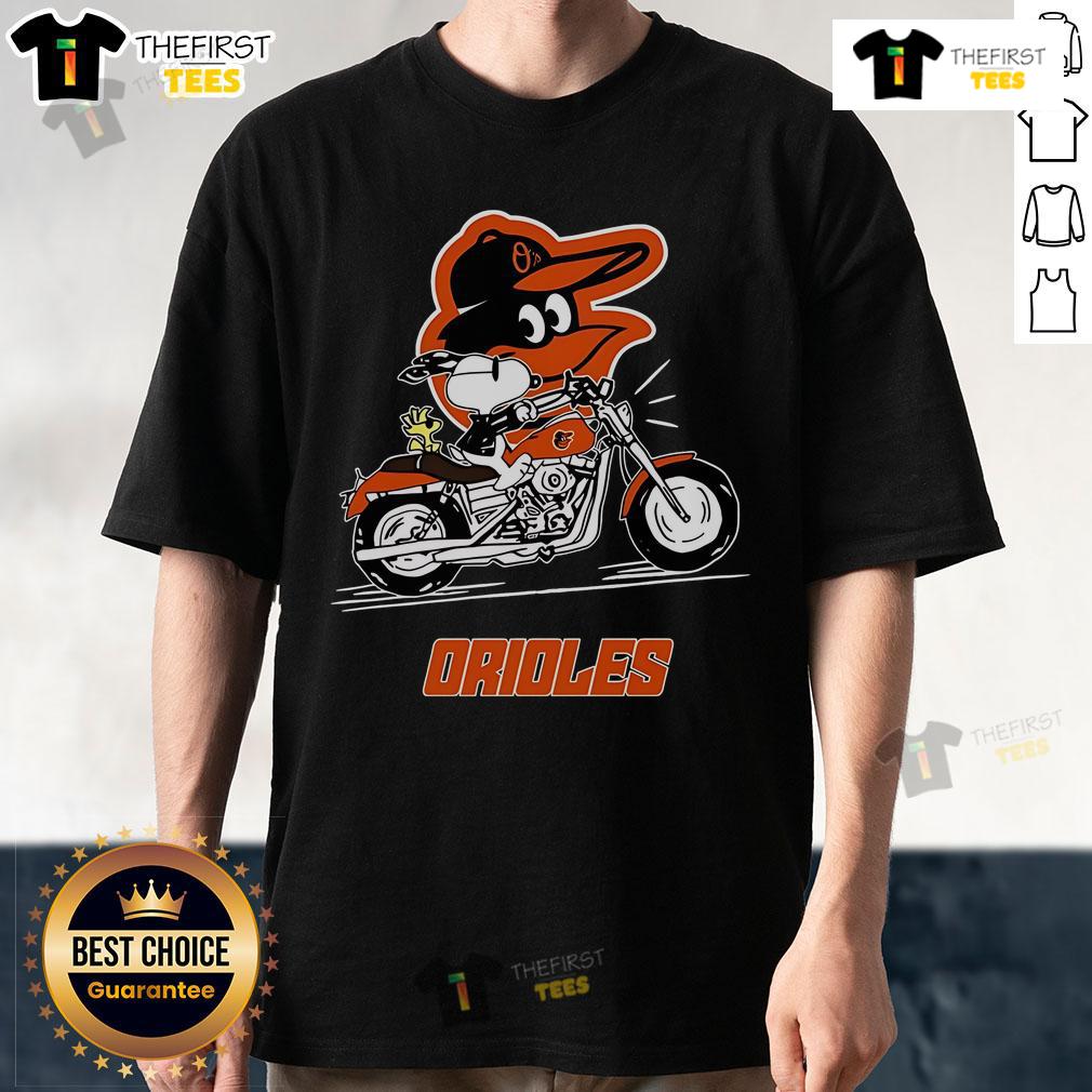 Alt Text: Original Snoopy and Woodstock riding a motorbike on a Baltimore Orioles T-shirt, featuring vibrant colors and playful design.