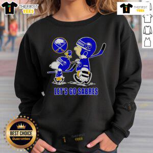 Buffalo Sabres sweatshirt featuring Snoopy, Charlie Brown, and Woodstock with 'Let's Go Sabres' slogan.