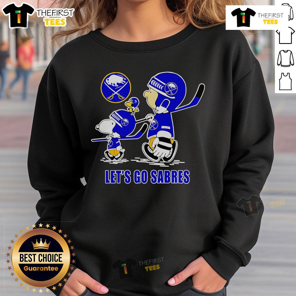Buffalo Sabres sweatshirt featuring Snoopy, Charlie Brown, and Woodstock with 'Let's Go Sabres' slogan.