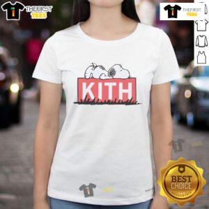 Alt Text: Cute Snoopy sleeping on a Kith ladies tee, showcasing a trendy and playful design perfect for casual wear.