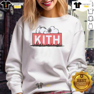Cute Snoopy sleeping graphic on a cozy Kith sweatshirt, perfect for casual wear and Peanuts fans.