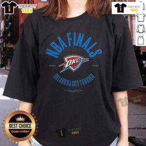 Alt Text: Official Oklahoma City Thunder 2025 NBA Finals Charging Foul Ladies Tee featuring team colors and logo design.