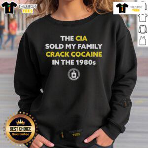 Top The CIA Sold My Family Crack Cocaine in the 1980s sweatshirt featuring bold graphic design and vibrant colors.