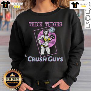 Girl in a gym wearing a 'Top Thick Thighs Crush Guys' sweatshirt, showcasing fitness style and confidence.