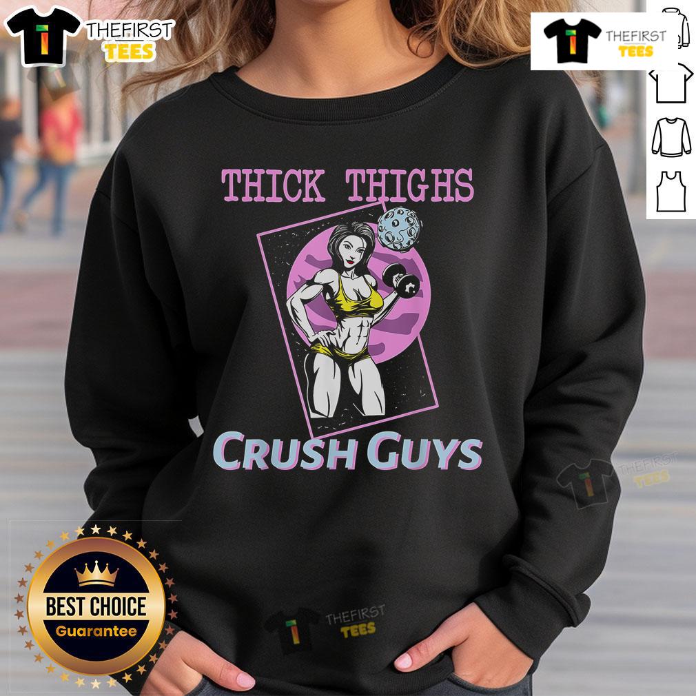 Girl in a gym wearing a 'Top Thick Thighs Crush Guys' sweatshirt, showcasing fitness style and confidence.