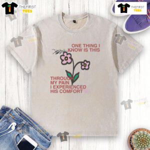 Alt Text: Comfort washed t-shirt with a cute design, showcasing the phrase about finding comfort through pain.