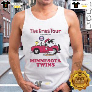 Woman wearing a Minnesota Twins Eras Tour Snoopy tank top at a baseball game, showcasing team spirit and style.