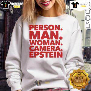 A nice person wearing an Epstein sweatshirt poses for the camera with a smile, showcasing casual style and warmth.