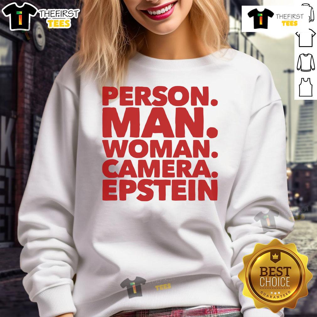 A nice person wearing an Epstein sweatshirt poses for the camera with a smile, showcasing casual style and warmth.