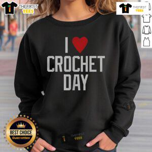 Cozy 'Pretty I Love Crochet Day' sweatshirt featuring a colorful crochet design, perfect for crochet enthusiasts.