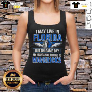 Florida resident wearing a Dallas Mavericks tank top on game day, showcasing team pride and style.