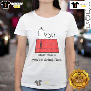 Alt Text: Cute motivational Snoopy graphic on a ladies tee with 'Slow Down You're Doing Fine' text, perfect for casual wear.