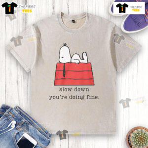 Cute motivational Snoopy 'Slow Down, Youre Doing Fine' washed t-shirt showcasing a relaxed, inspiring design.