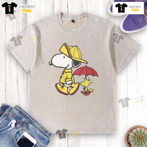 Cute Peanuts Snoopy and Woodstock rainy day design on a washed t-shirt, perfect for fans of the beloved comic.