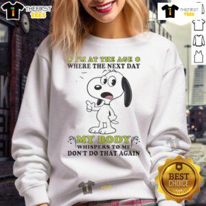 Alt Text: Cute Snoopy sweatshirt featuring the quote about aging and body aches, perfect for casual wear and Snoopy fans.