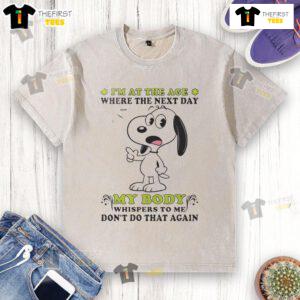 Alt Text: Cute Snoopy graphic on a washed t-shirt with the quote about body whispers, perfect for relaxed, humorous fashion.