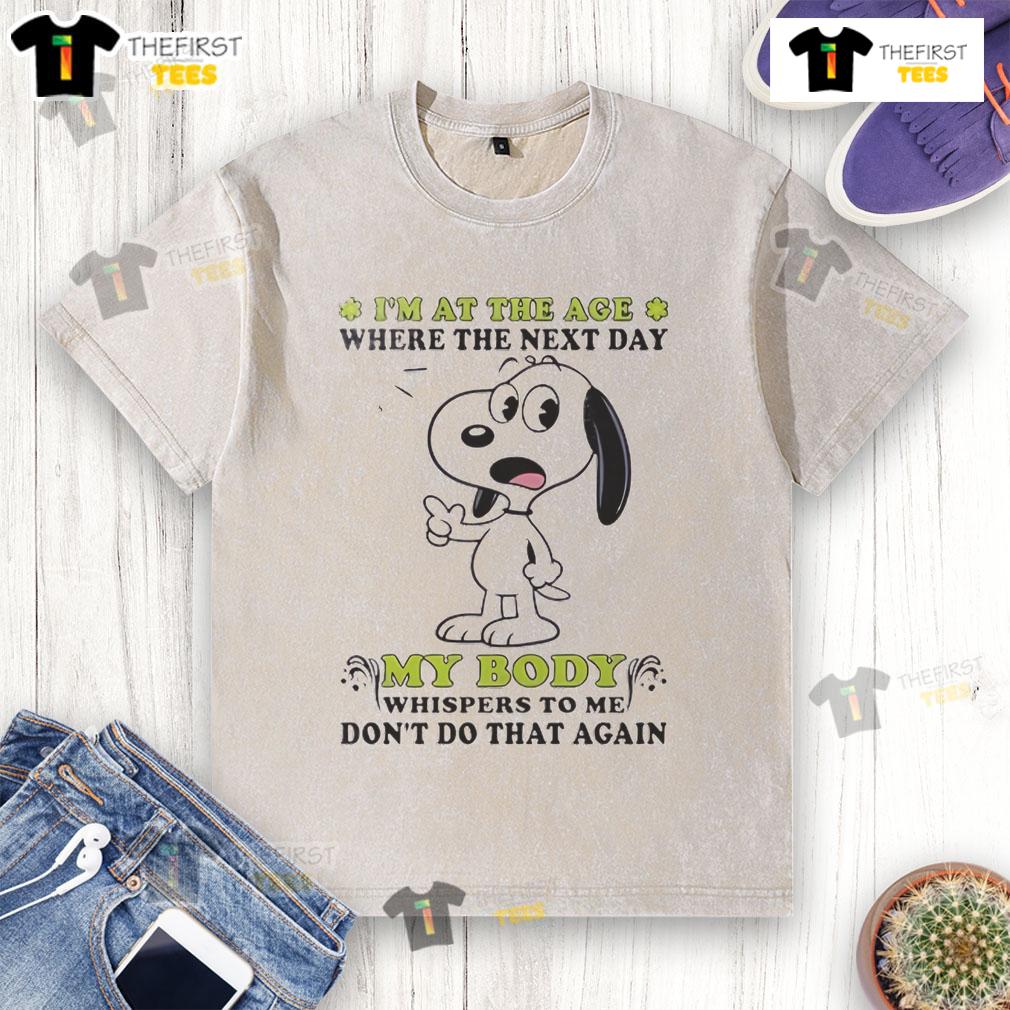 Alt Text: Cute Snoopy graphic on a washed t-shirt with the quote about body whispers, perfect for relaxed, humorous fashion.