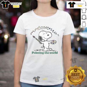 Cute Snoopy painting the world on a ladies tee, featuring vibrant colors and playful design for fans of Peanuts.
