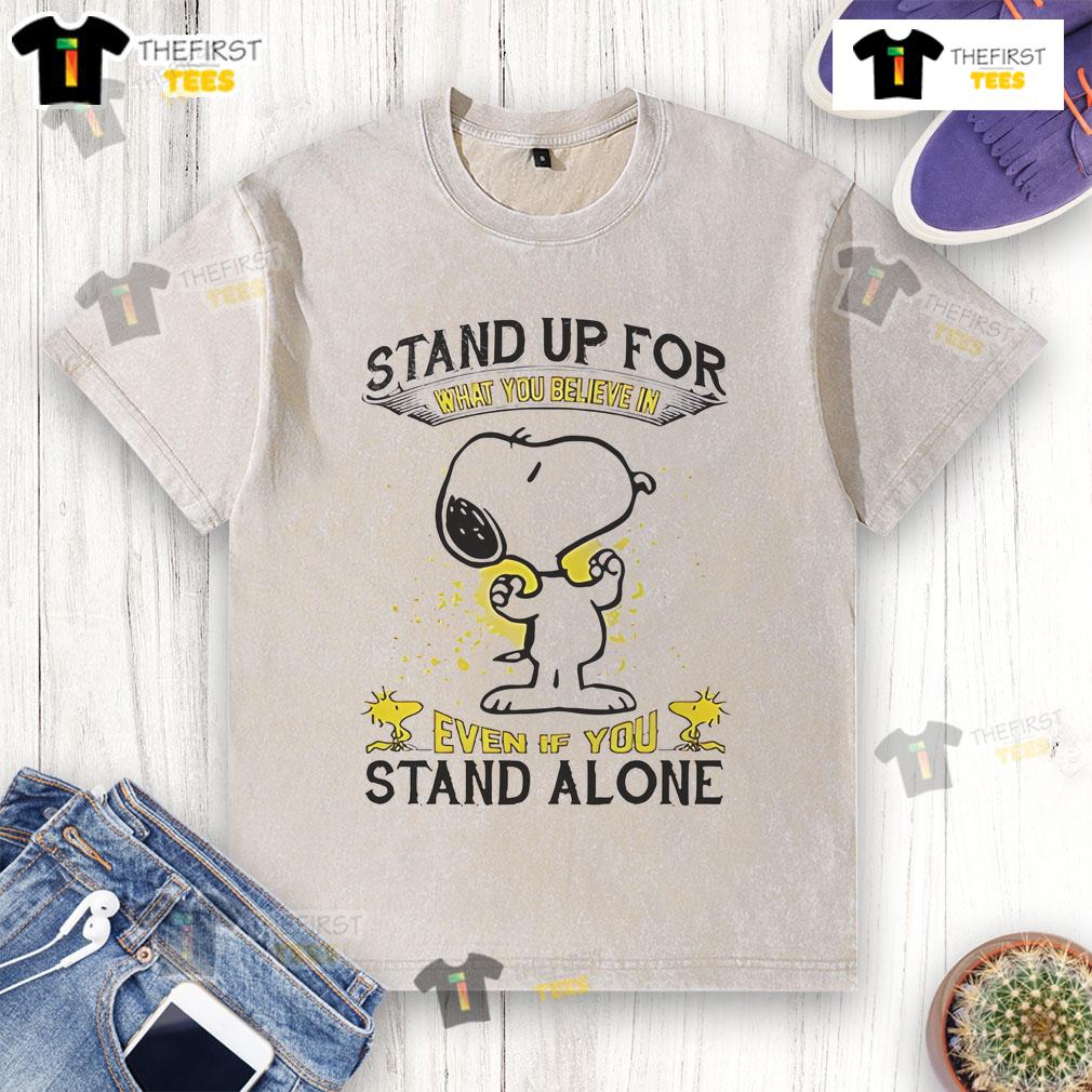 Alt Text: Cute Snoopy stand-up graphic on a washed t-shirt, inspiring message to stand for what you believe in, even alone.